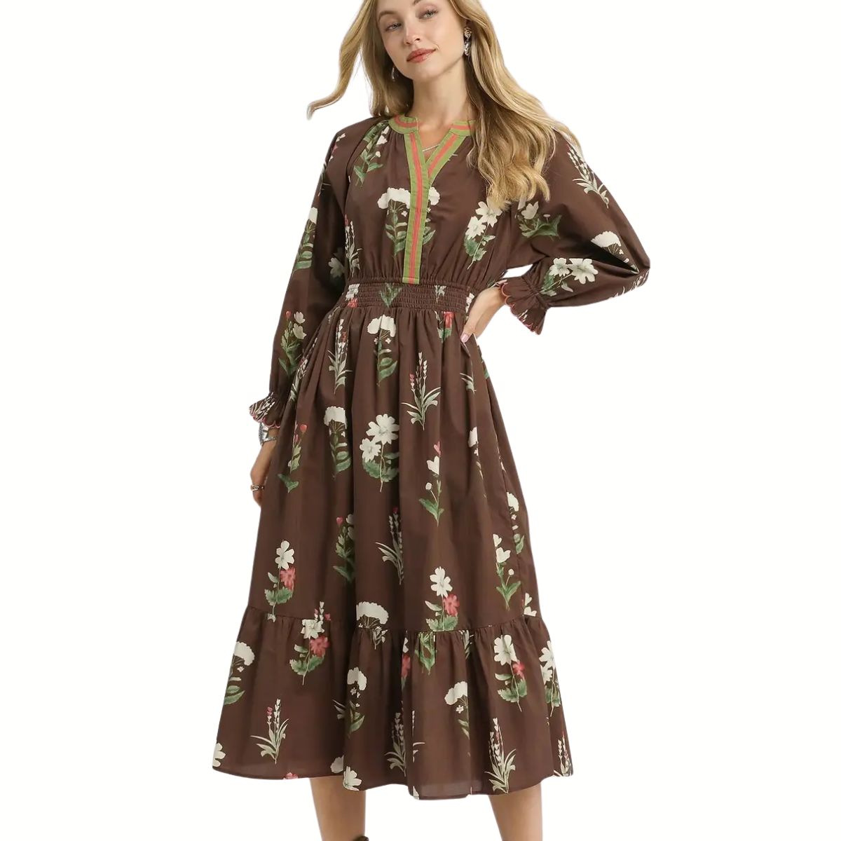 A woman models the Umgee Floral Print V Neck Midi Dress with ruffled details, featuring a smocked waist and green trim, against a plain white background.