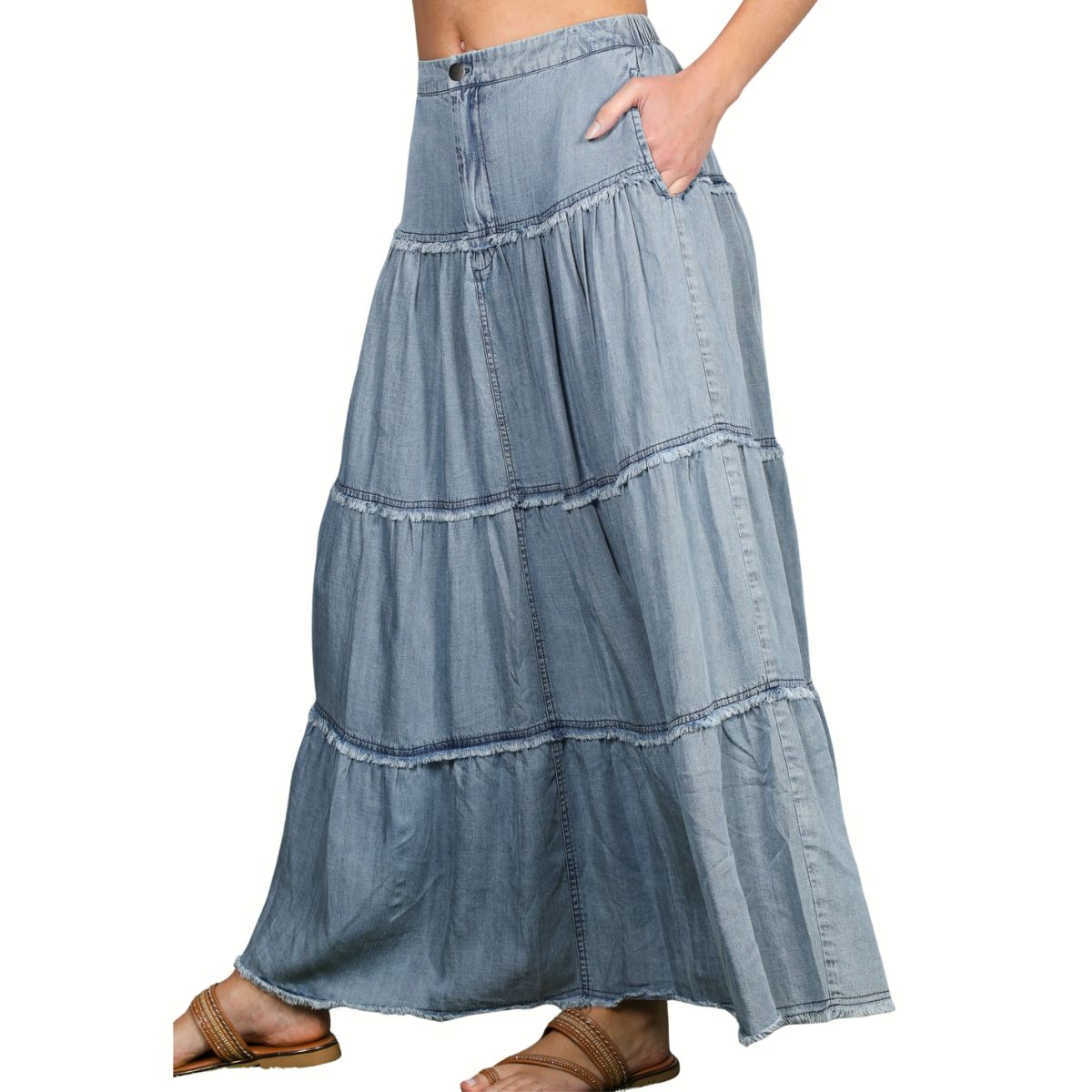 A person wearing the FASHION GO Chambray Maxi Skirt With Elastic Back in light blue with pockets, paired with brown sandals.