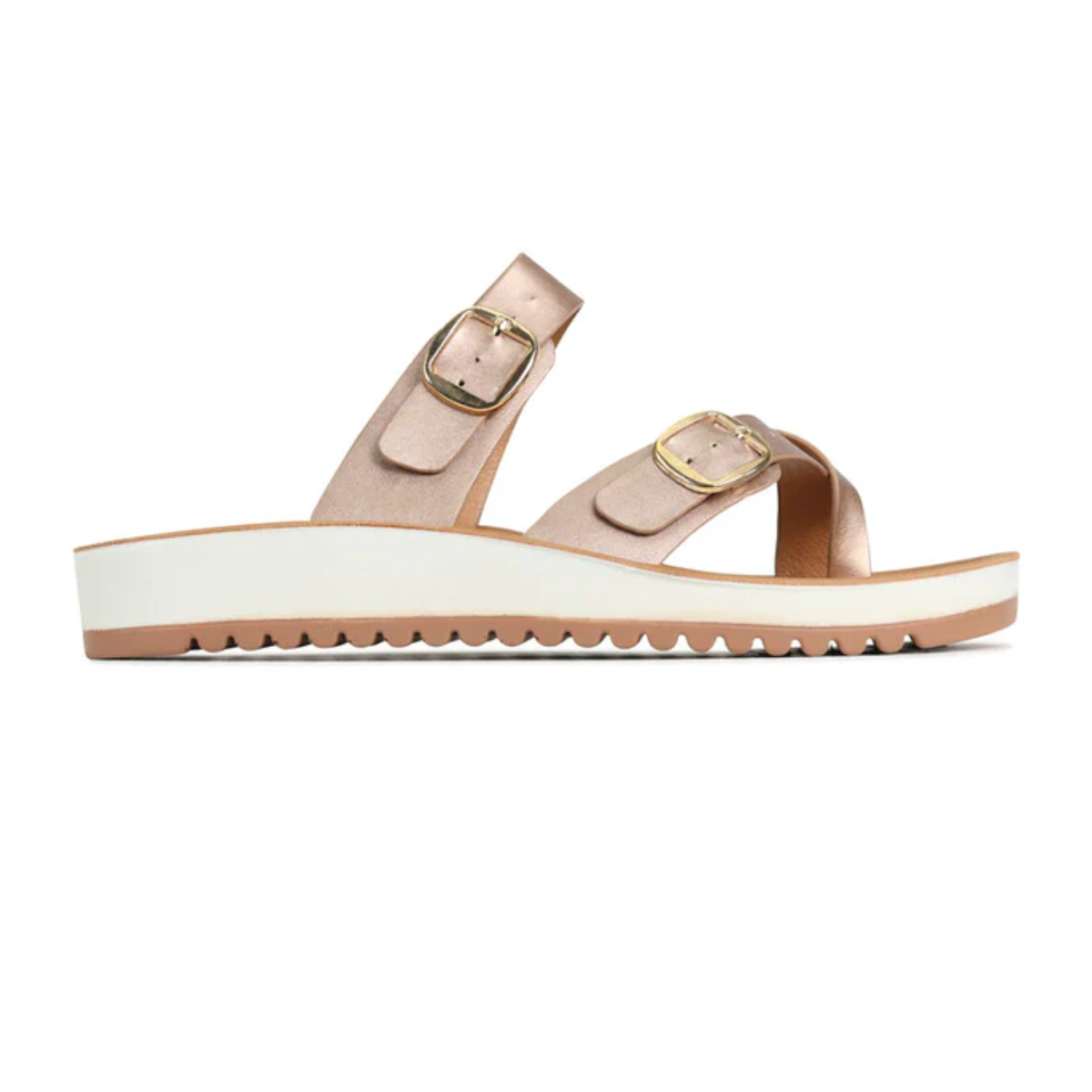 Side view of the Los Cabos Nin Sandal in Rose Gold, featuring pink adjustable straps, two gold buckles, and a white platform sole with a tan bottom. Crafted from vegan leather for eco-friendly style and comfort.