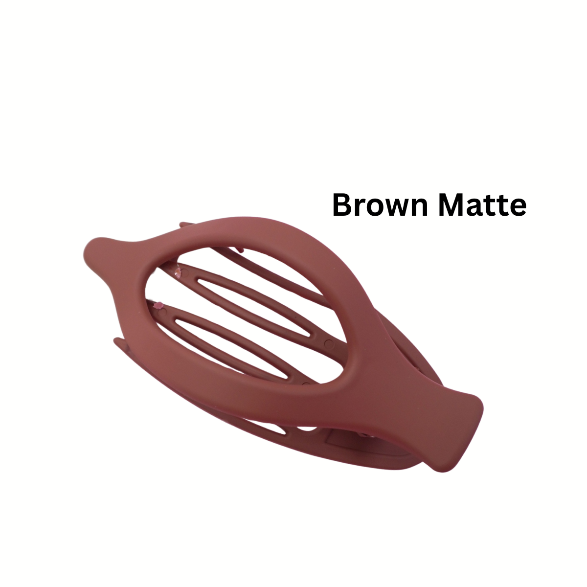 The Oval Lay Down Flat Claw Hair Clip by FASHION GO, shown in brown matte against a white background, features an open design for a secure grip. "Brown Matte" is displayed beside this stylish accessory from the Assorted Colors collection.