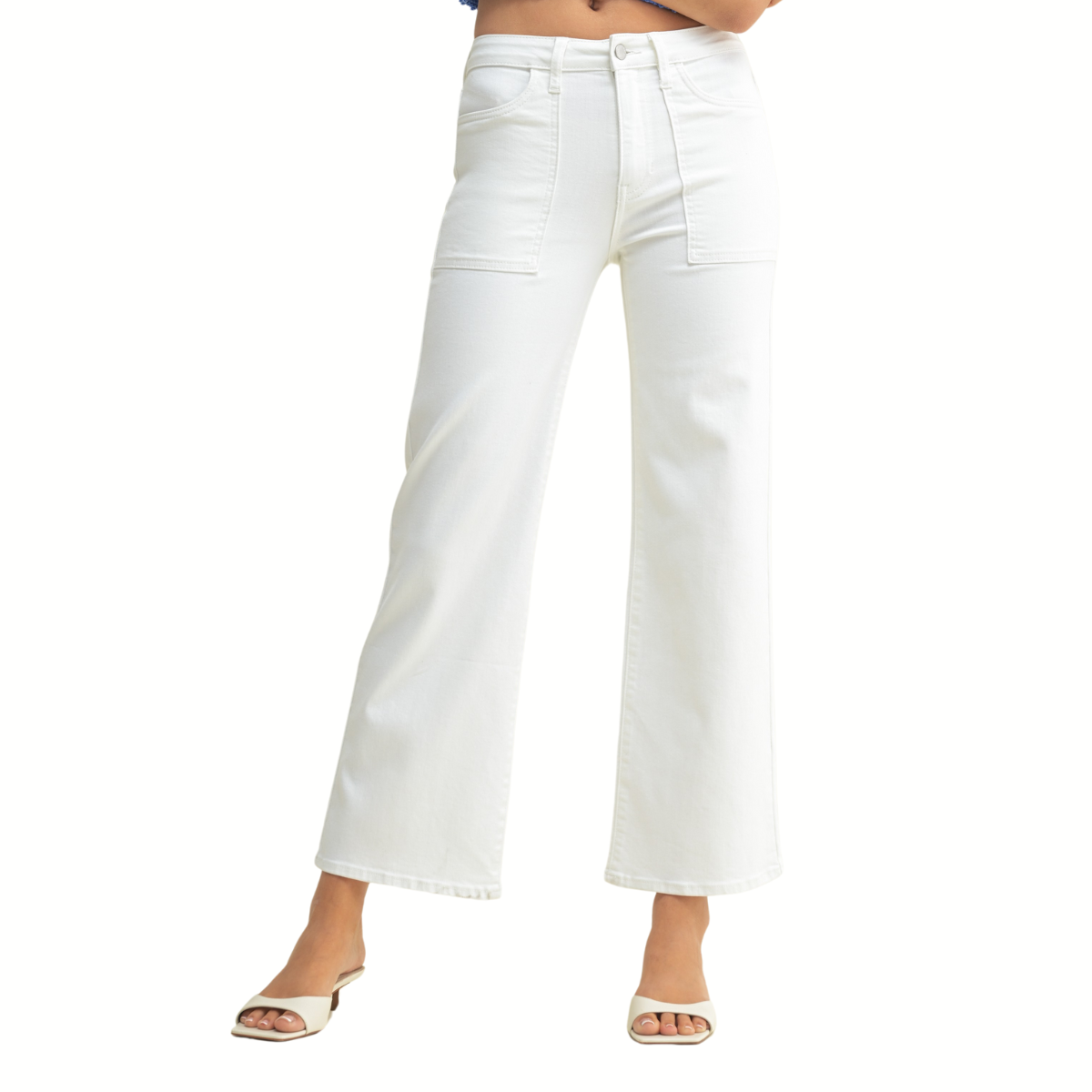 Model wears the FASHION GO Utility Pocket Relaxed Jean in White—high-waisted, wide-leg denim with utility pockets—paired with open-toed heeled sandals, shown from waist to feet against a plain background.
