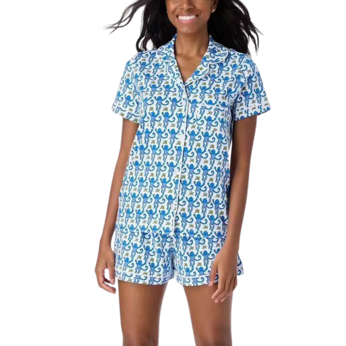 A woman is wearing the FASHION GO Graphic Print Pjs Top & Shorts Set, which features a playful blue and white pattern on both the short-sleeve button-up shirt and matching shorts.
