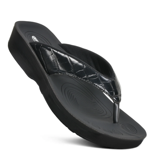 Felice Black Croco Pattern Flip Flops by Aerothotic with quilted strap on a white background.