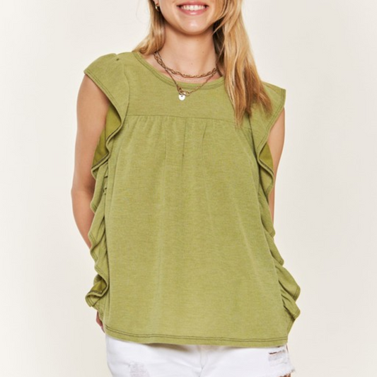 Woman wearing an Avocado Knit Top from Flipflops & Whatnots with ruffle trim details.