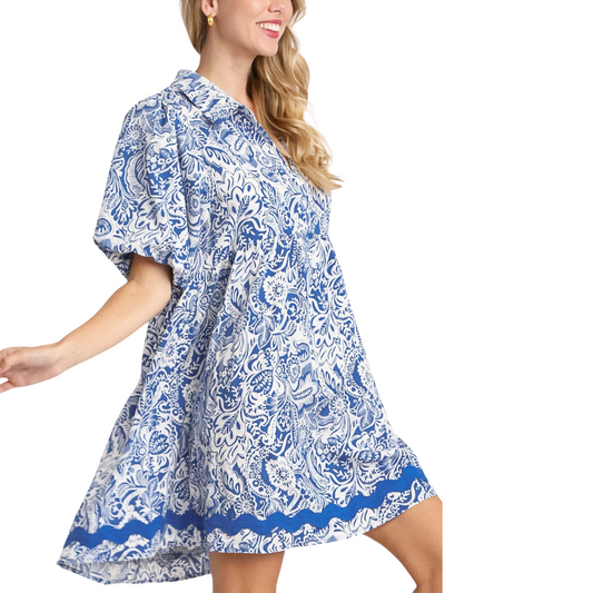 The FASHION GO blue and white paisley mini dress with balloon sleeves is worn by a woman.