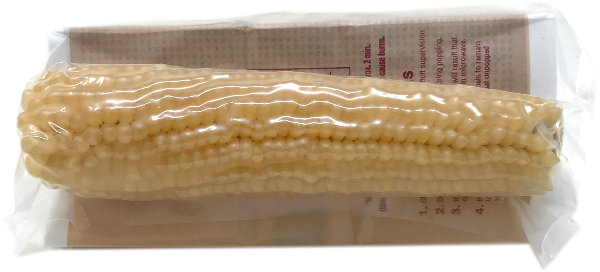 Amish Country Popcorn’s White Popcorn Microwave Cobs come as a single ear vacuum-sealed in plastic, set atop a folded brown paper wrapper with printed microwave popping instructions.