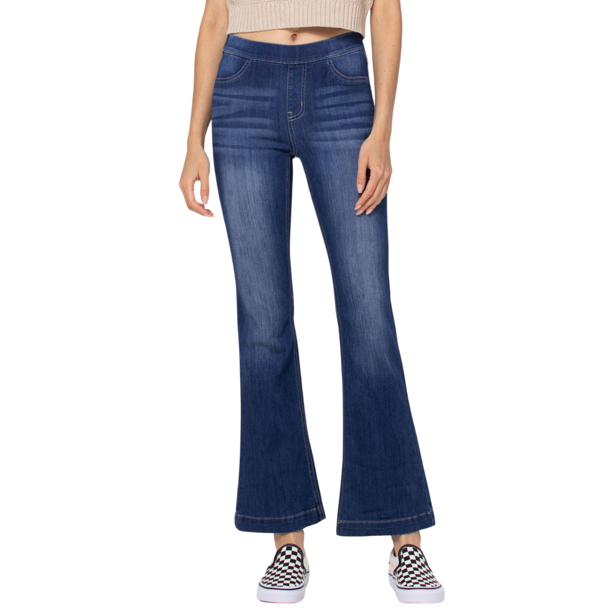 Woman wearing cello pull on flare jeans with a 30-inch inseam and checkered sneakers with a tiny heel.