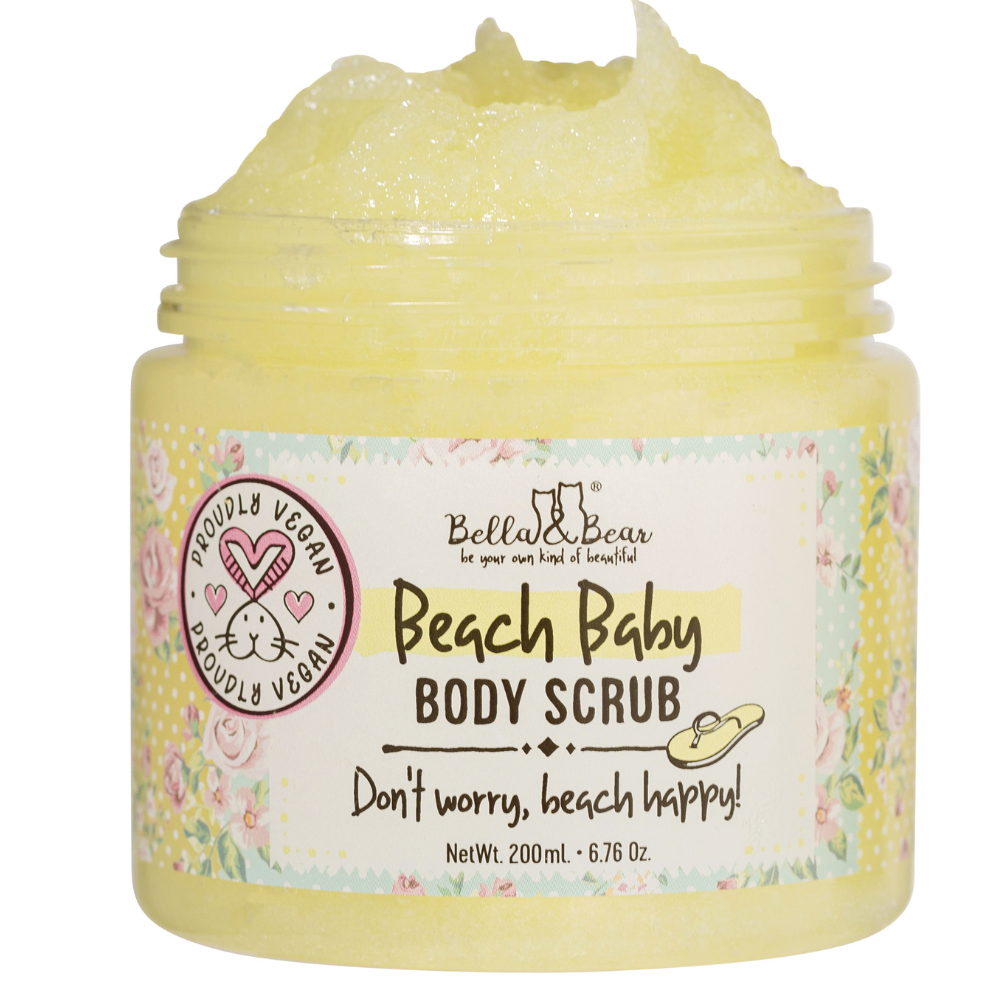 A 6.7oz jar of Bella & Bear Beach Baby Body Scrub with yellow vegan scrub and the slogan “Don't worry, beach happy!”—a nourishing body wash and moisturizer for your radiant beach glow.