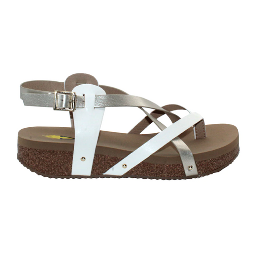 A side view of a Engie in Platinum sandal by Volatile with a cork footbed and metal buckle.