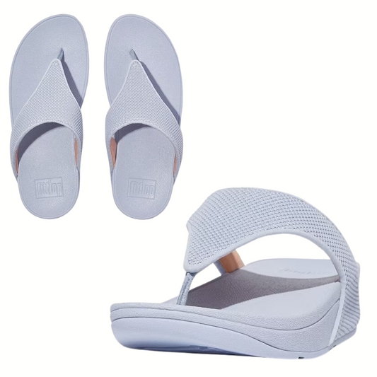 A pair of gray Lulu Water Resistant Thong flip flops in SkyWash Blue by FITFLOP USA LLC with a thick, water-resistant sole displayed from different angles.