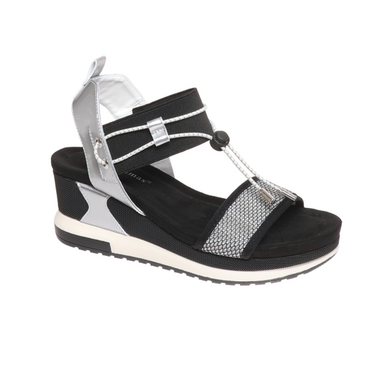 A single Olem Lyra4 Sporty Wedge Sandal in Black and Silver Combo with a wedge heel on a white background.