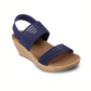 A single navy blue Sheer Luck Wedge by Sandal Skechers women's wedge sandal with elastic straps and a Luxe Foam cork sole by SKECHERS USA INC.