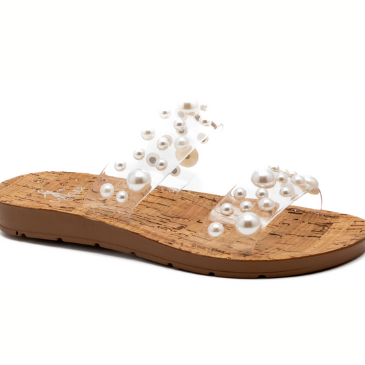A Dome N Atrix Clear Pearl Slide Sandal by Corkys featuring clear straps adorned with varying sizes of faux pearls, isolated on a white background.