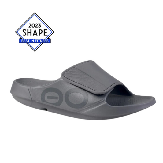 A single gray Sport Flex In Slate sports slide sandal with an adjustable strap, recognized by Shape magazine as a "best in fitness" product for 2023.