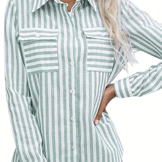 Woman wearing a green and white striped tunic top from FASHION GO, focusing on the torso and arms, with wavy blonde hair visible.