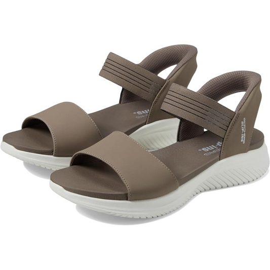 A pair of brown women's SKECHERS Summerville Ultra Flex Slip Ins Sandal in Taupe with white soles.