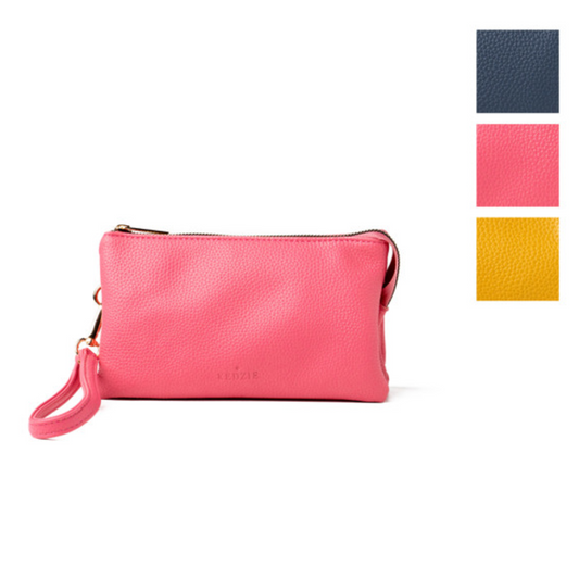 A pink Convertible Crossbody Wallet/Purse crafted from vegan leather, with a color palette showing navy blue, pink, and mustard yellow swatches by DM MERCHANDISING INC.