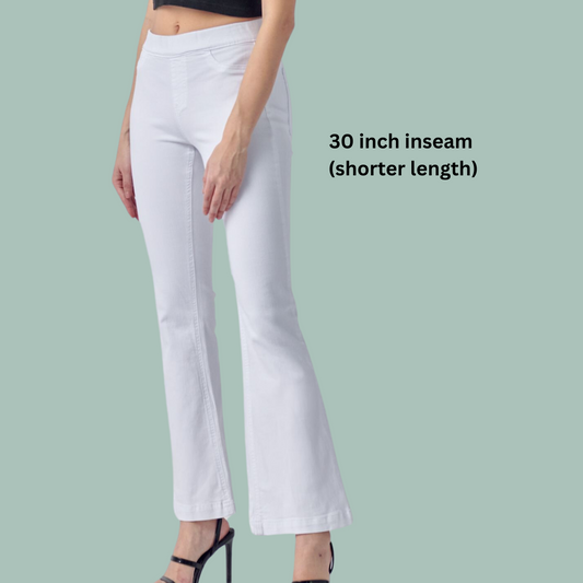 A woman wearing FASHION GO Cello 30" inseam Pull on Denim Flare Jeans in White and a black top.