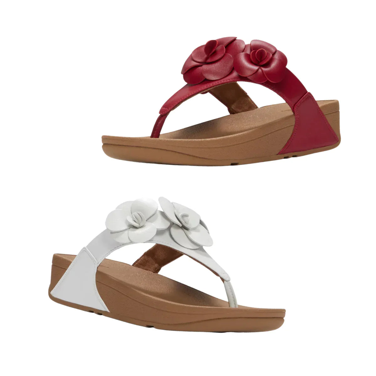 Two pairs of wedge sandals with floral decorations: one in red with red flowers, and one in white with white flowers, both with tan soles.