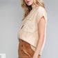 A woman with long blonde hair wears the Patch Pocket Ribbed Knit Short Sleeve Sweater from Shewin in beige, paired with a brown skirt. She stands sideways against a gray backdrop, showcasing a chic look ideal for transitional weather.