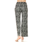 A person stands barefoot, shown from the back, wearing Leggings Depot’s Buttery Soft Print PJ Pants—gray high-rise with a black leopard print and wide-leg silhouette.