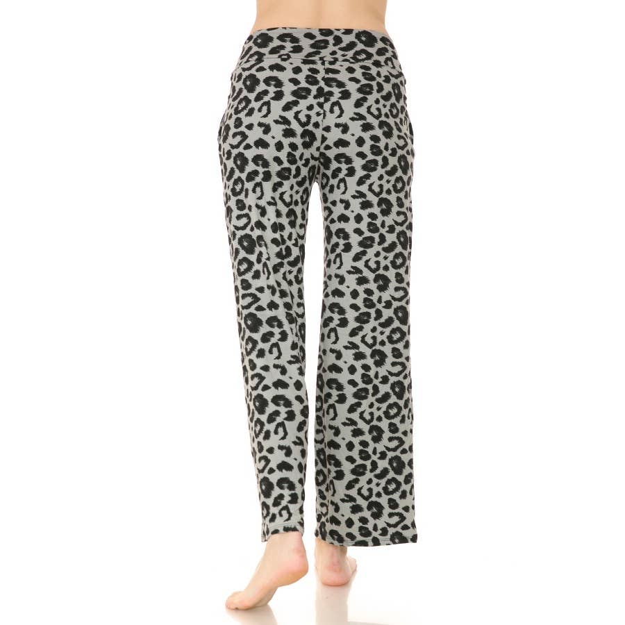 A person stands barefoot, shown from the back, wearing Leggings Depot’s Buttery Soft Print PJ Pants—gray high-rise with a black leopard print and wide-leg silhouette.