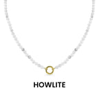 WJW Semi Precious Natural Stone Charm Keeper Necklace crafted with white howlite stones and finished with a circular 18K Gold PVD-coated clasp, elegantly displayed on a white background with the word "HOWLITE" below—a timeless accessory designed for enduring style.