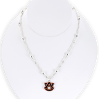 The Seasons Jewelry Auburn Glitter Enamel Logo Necklace features a silver beaded chain and a sparkling AU logo charm pendant, beautifully presented on a white display bust.