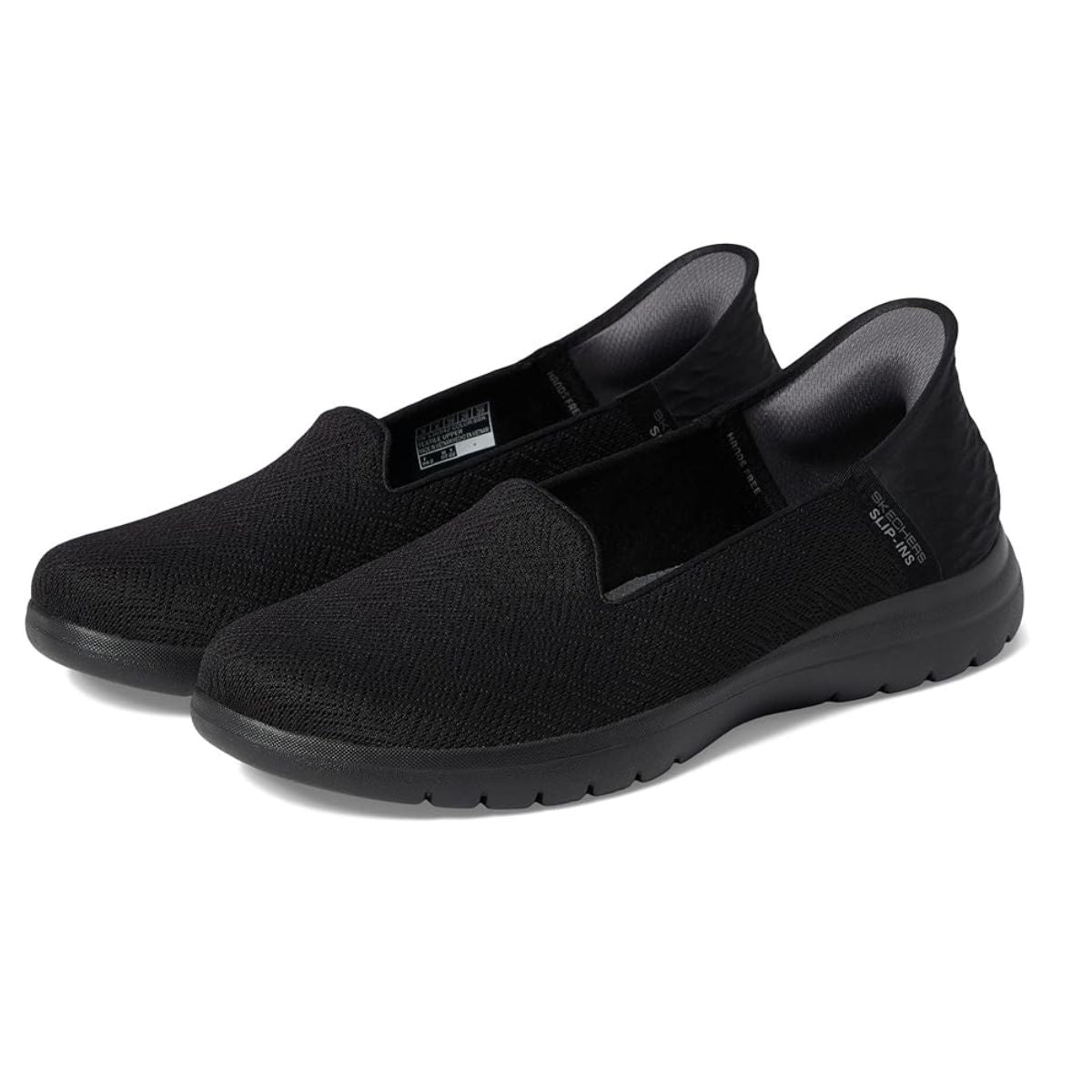 A pair of Skechers On the Go in black, size 7, showcasing textured fabric uppers and cushioned soles with heel pillows for added foot support, displayed on a white background.