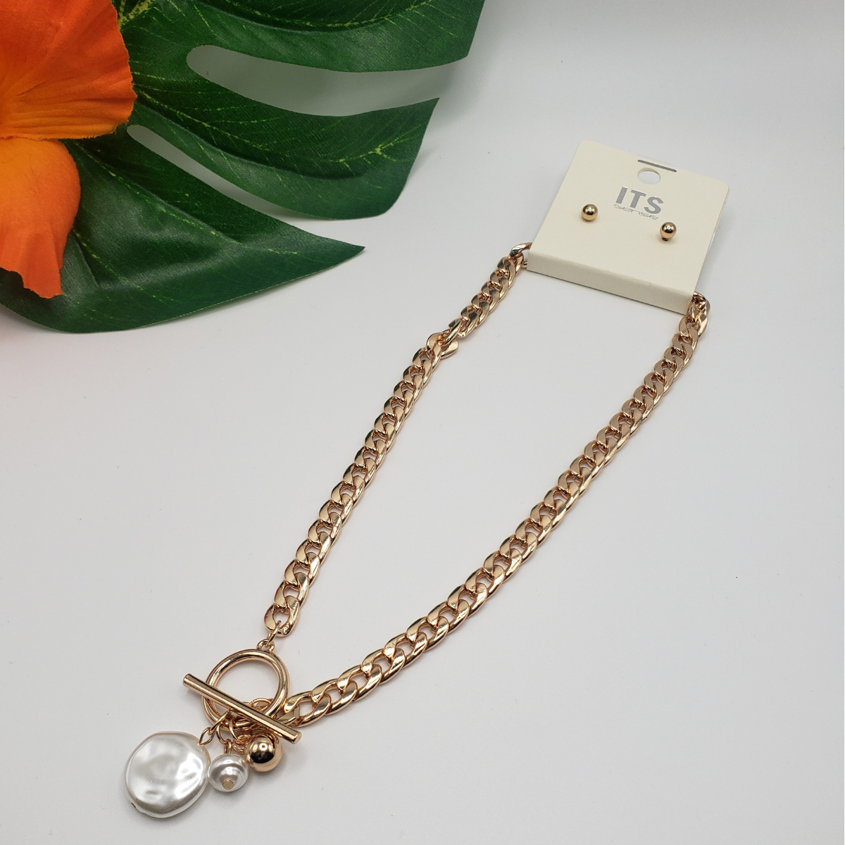 A SPECIAL EFFECTS Coin Pearl Toggle Chain Necklace and earring set featuring a Fresh Water Pearl charm on a goldtone chain.