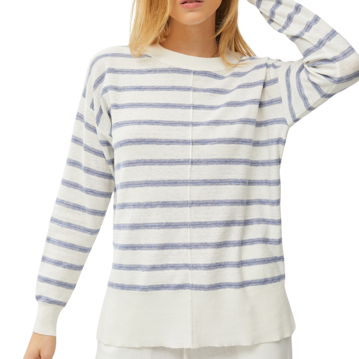 A woman wearing a lightweight Fashiongo "Stripes It Is - Blue" sweater with long sleeves.