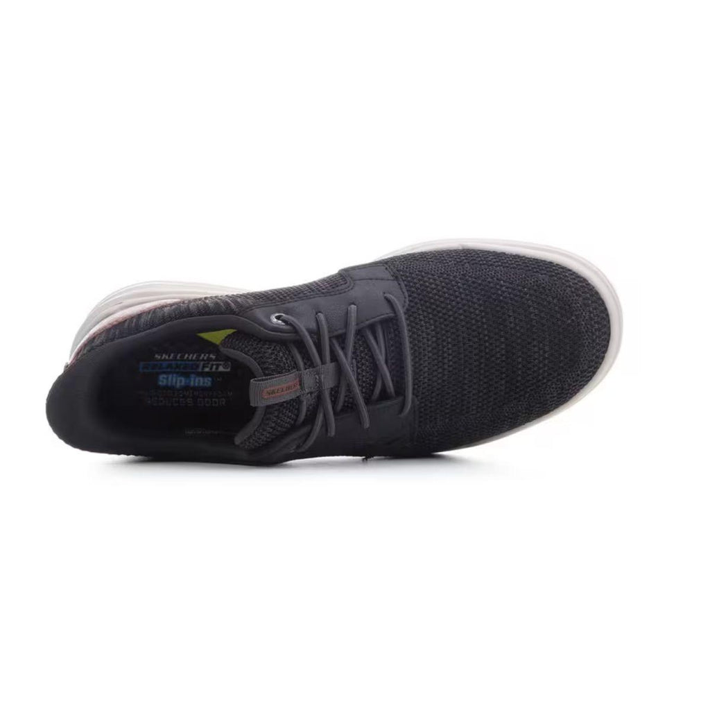 Top view of a black Skechers Slip-ins Relaxed Fit Sterling - Ramone men’s athletic sneaker with a white sole, featuring a mesh upper, visible SKECHERS branding inside, and designed in a Relaxed Fit for comfortable casual wear.
