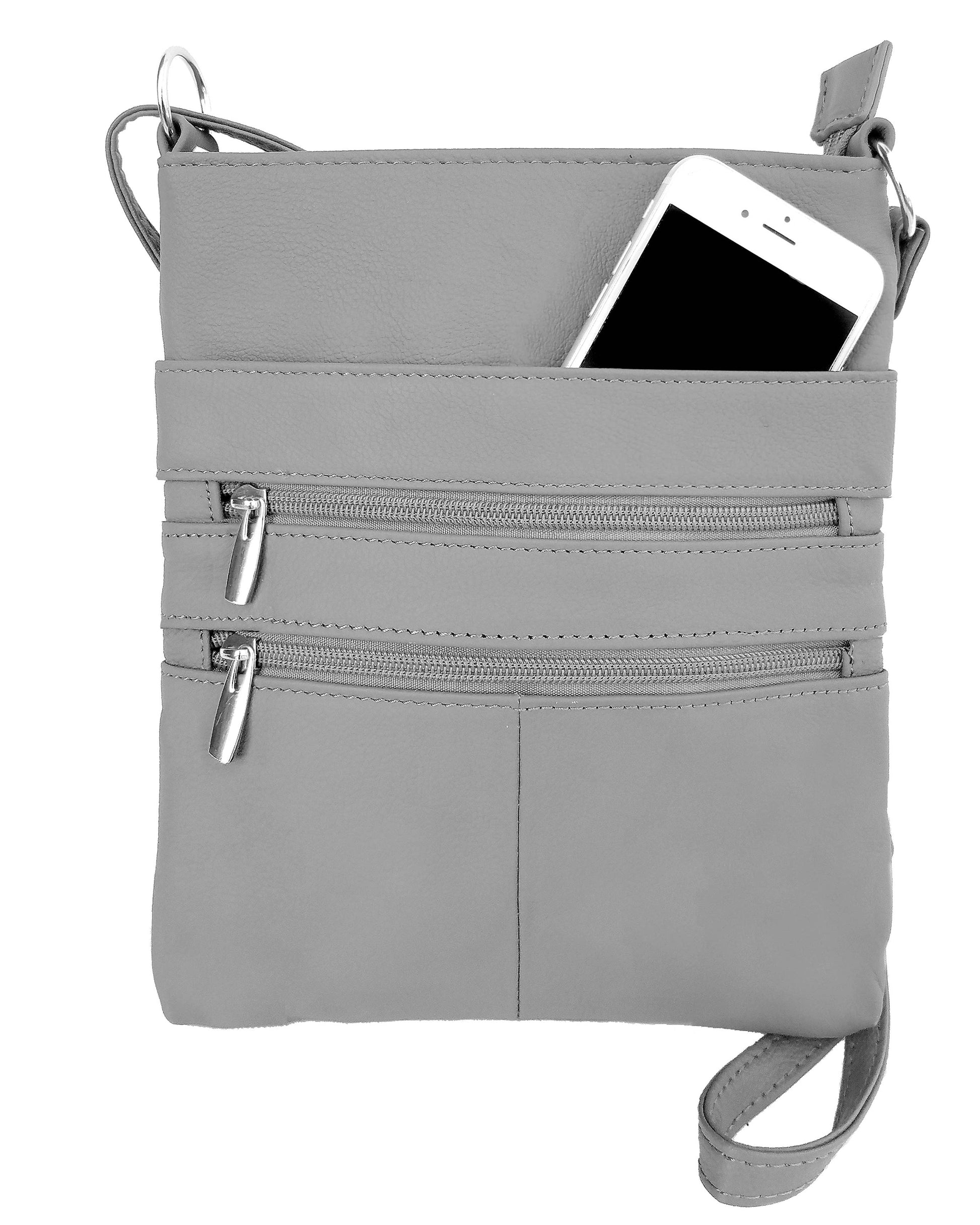 The Roma Leathers, Inc. Large cowhide leather crossbody shoulder bag in gray features two front zippered pockets and an adjustable shoulder strap, shown here with a smartphone partially tucked into the top pocket.