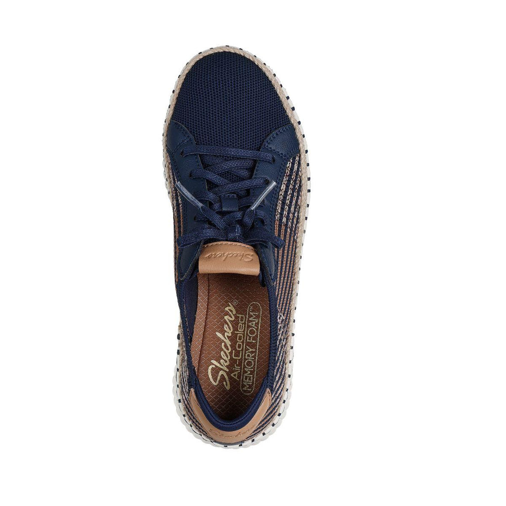 Top view of the SKECHERS Wilshire Boulevard Breezy Stroll Navy Sneaker featuring tan accents, a mesh upper, and a white sole. Designed for lightweight comfort, this casual shoe has “Air Cooled Memory Foam” printed on the insole.