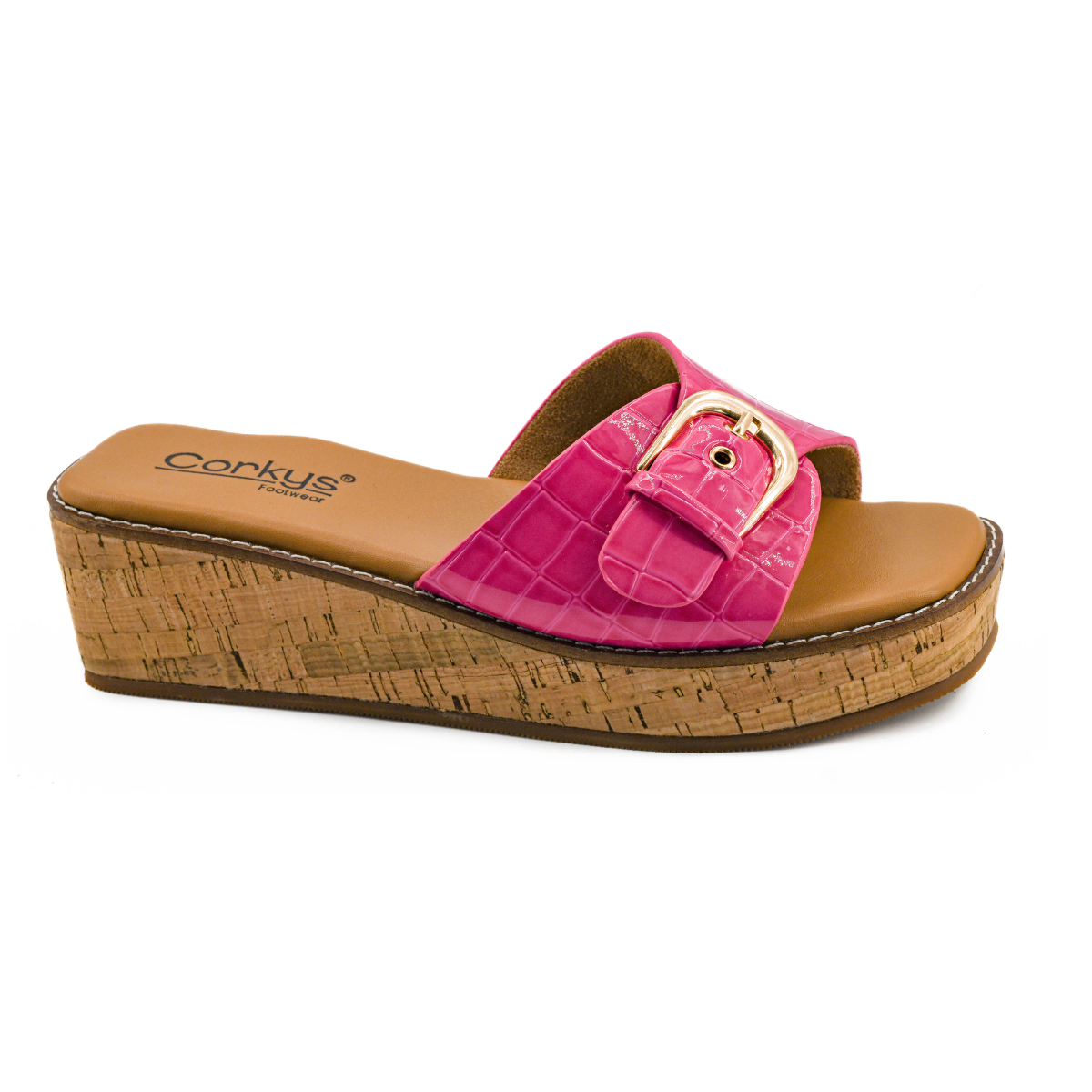 The CORKY'S FOOTWEAR INC Reality Wedge Slide in Pink features a cork sole, cushioned footbed, and a pink patent croco-textured strap with a large gold buckle. Main image