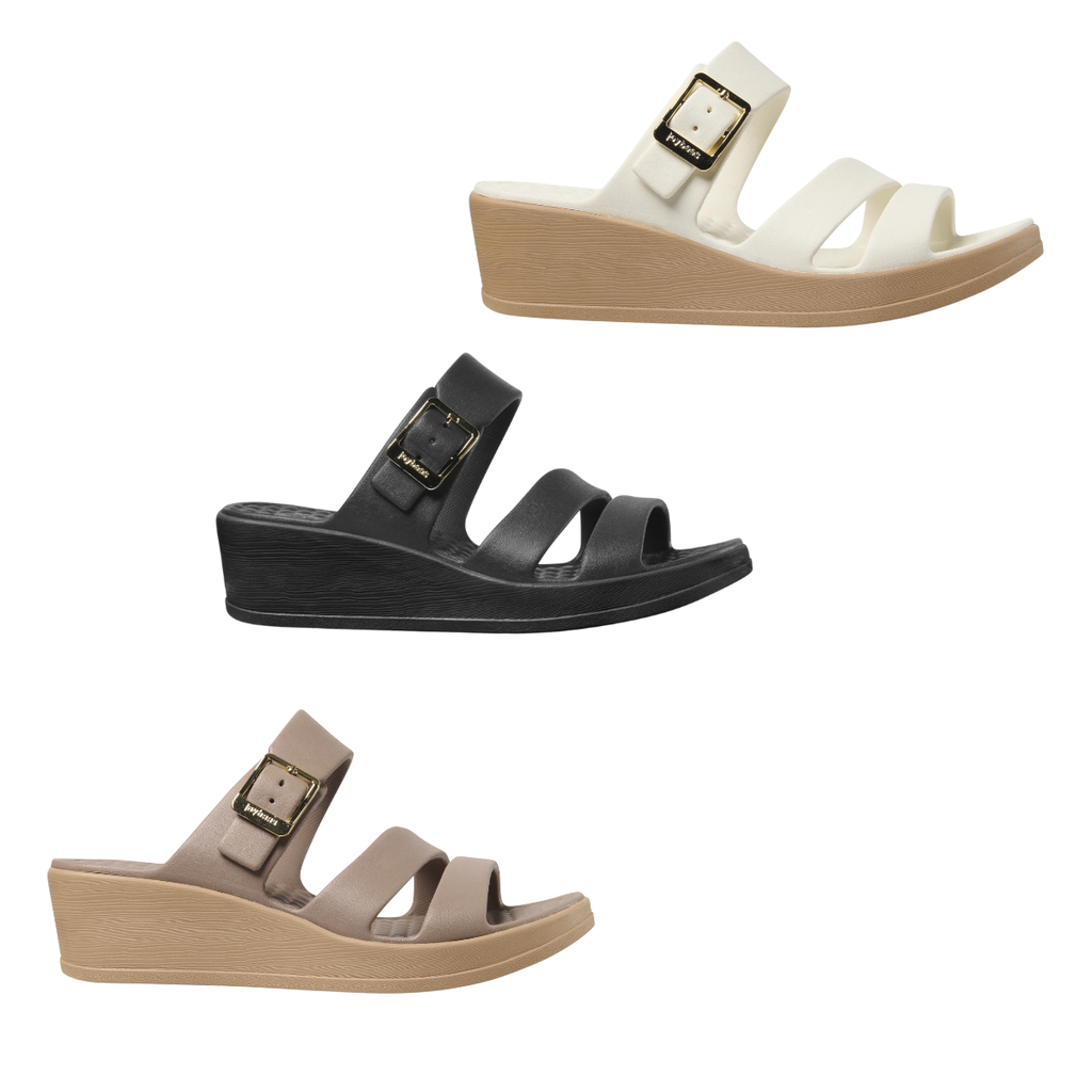 The JOYBEES Soleil Wedge is a women’s sandal in white, black, or beige with a thick lightweight sole, two front straps, and an adjustable instep buckle.