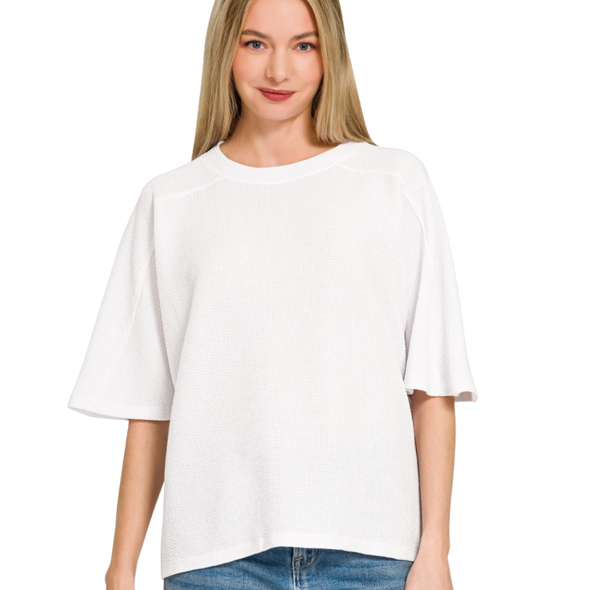 A woman wears the Zenana Double Knit Short Sleeve Top in white with blue jeans, standing facing forward against a plain white background.