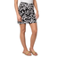 A person wears the Pine Apparel Black and White Print Skort with a white top and tan sandals, standing against a white background.