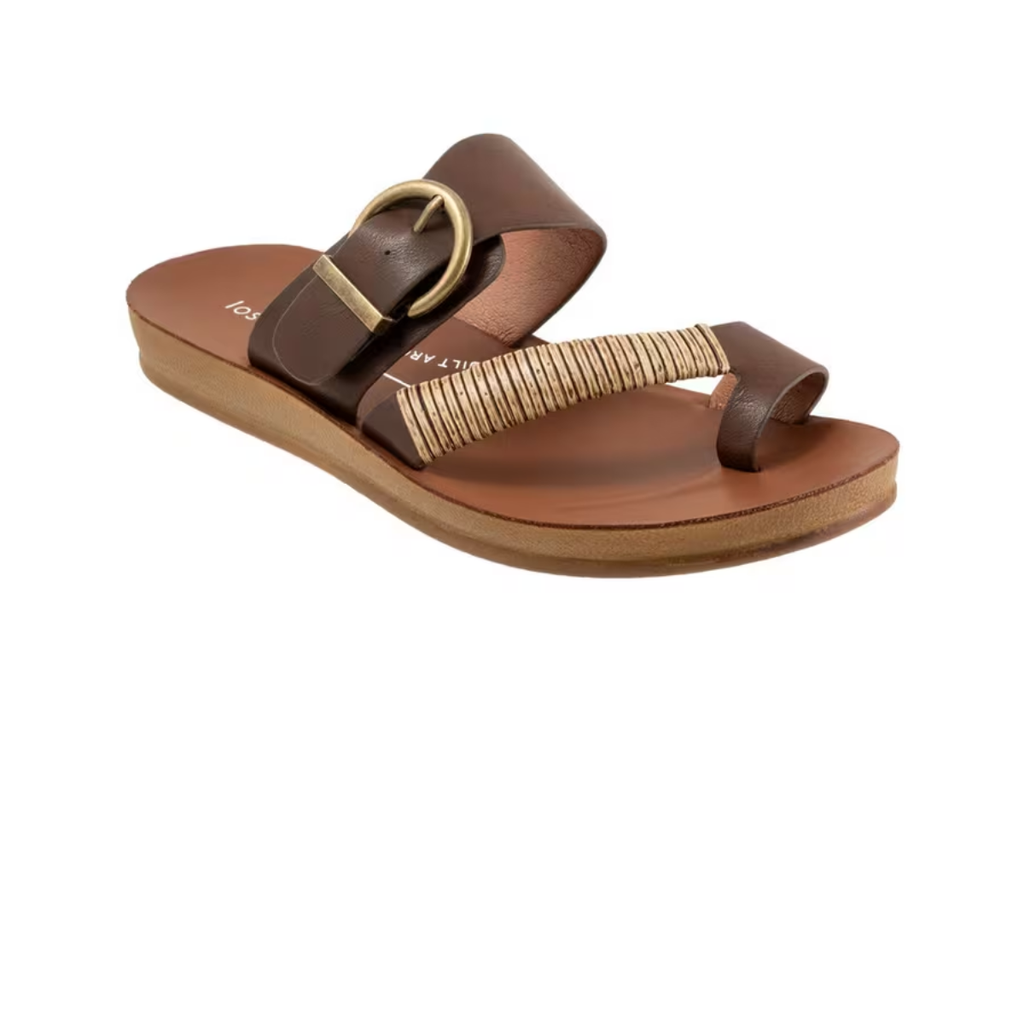 The Los Cabos Bria Sandals feature brown leather with a thick buckle strap, tan toe loop with decorative stitching, and a flat tan sole—making them the perfect summer thong.