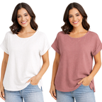Two women stand side by side, each with a hand in their jeans pocket, wearing Pine Apparel Cotton Gauze Roll Cuff Tees in white and mauve, featuring short dolman sleeves and a lightweight, loose fit.