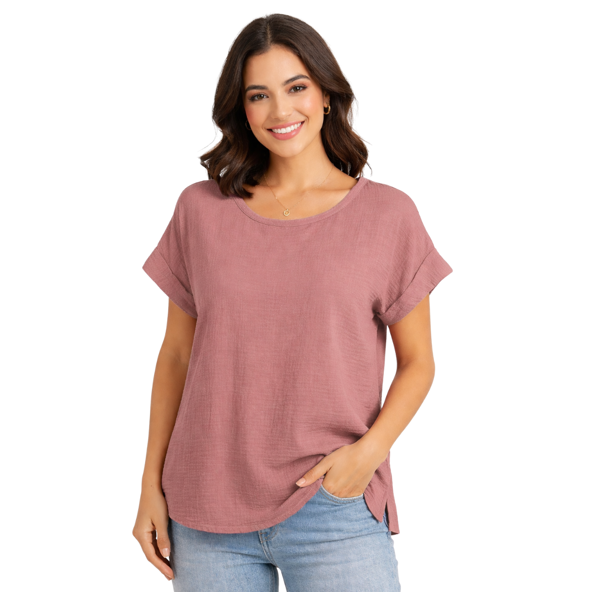 A woman with shoulder-length brown hair wears the Pine Apparel Cotton Gauze Roll Cuff Tee and light blue jeans, standing with one hand in her pocket and smiling at the camera.
