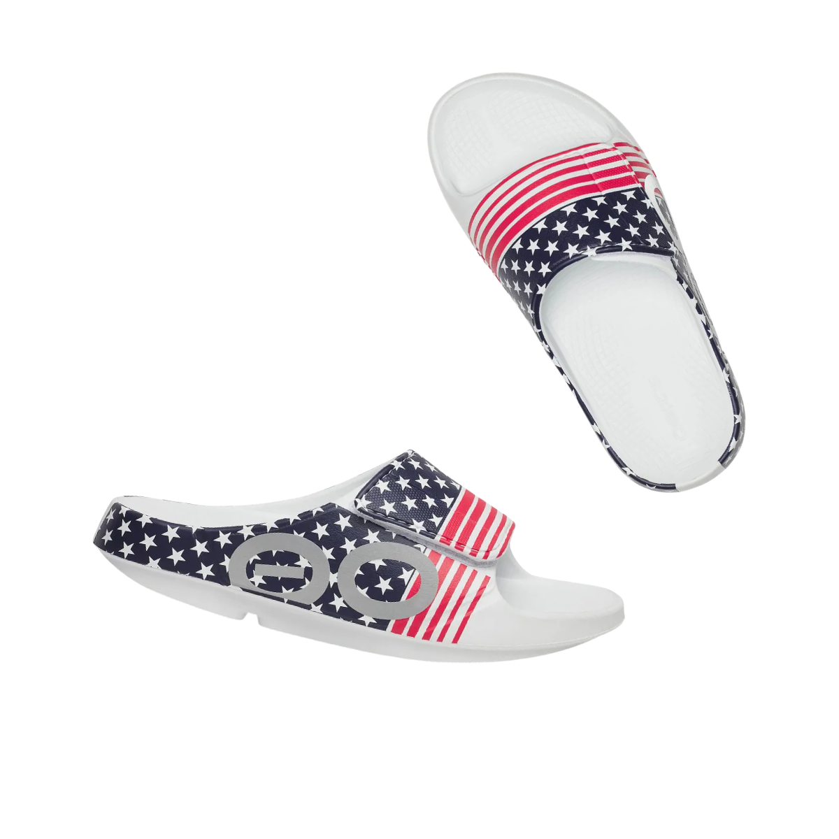 The oofos Ooahh Sport FX LT USA slide sandal features a red, white, and blue American flag design—ideal for comfort and foot health after any activity.