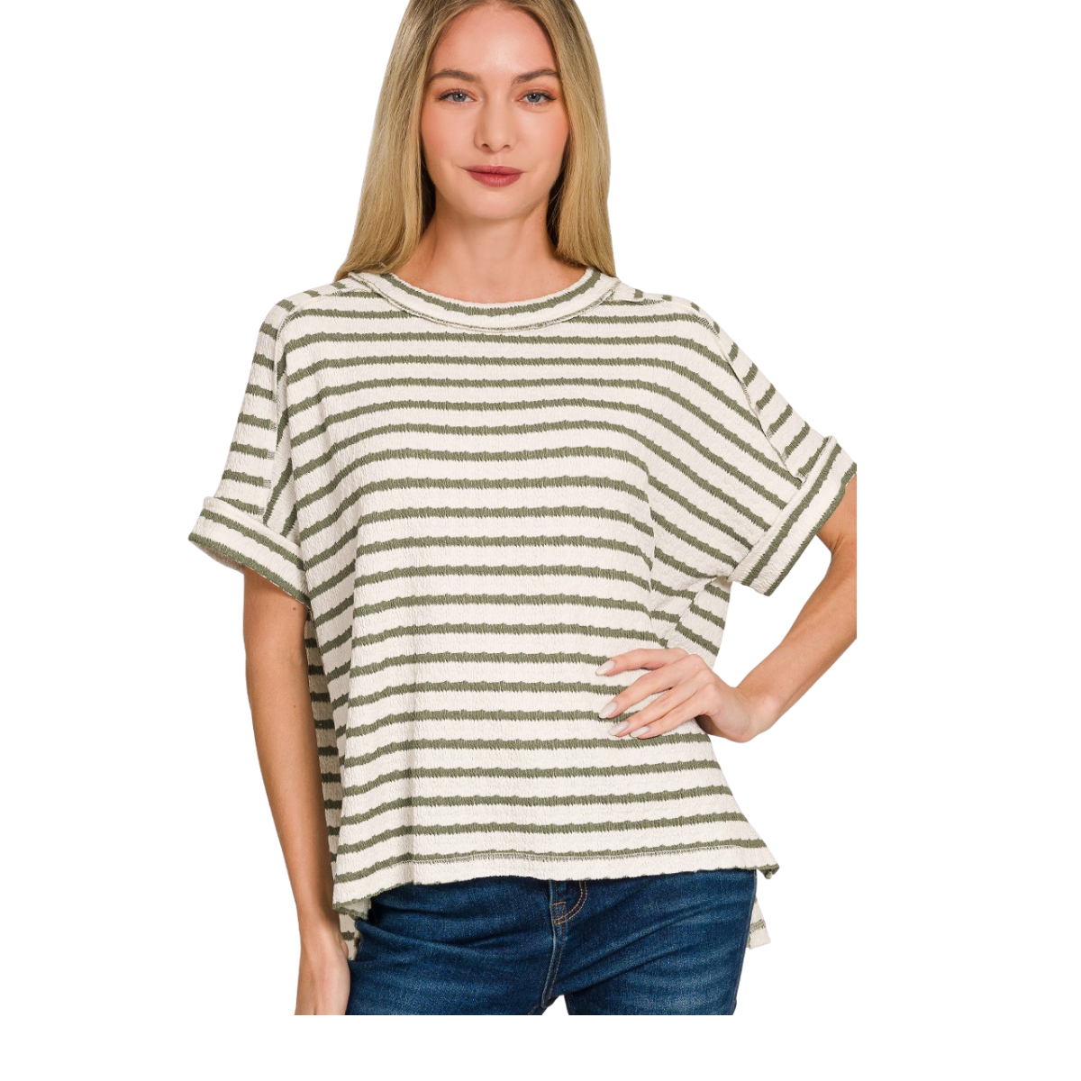 A woman wears the Zenana Stripe Jacquard Round-neck Box Tee—white and olive stripes, rolled cuffs, loose fit, hi-low hem—paired with blue jeans against a white background.