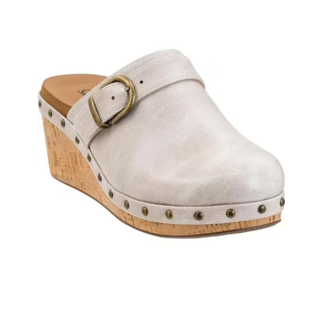 The Who Knew Platform Clog in Ivory by CORKY'S FOOTWEAR INC is a comfortable slip-on with a cork sole, metal stud accents, an ivory platform design, and a brass buckle on top.