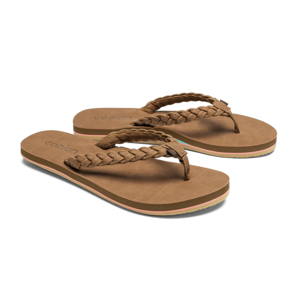 The COBIAN Braided Pacifica Ladies Flip Flop features brown braided straps, flat soles, and a cushioned footbed, shown against a white background.