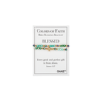 A beaded bracelet with a cross charm is displayed on a card labeled “BLESSED,” featuring a Bible verse from James 1:17. This faith jewelry piece by Flipflops & Whatnots is part of the Blessing Bracelets - Assorted collection, serving as a daily reminder of inspiration and gratitude.