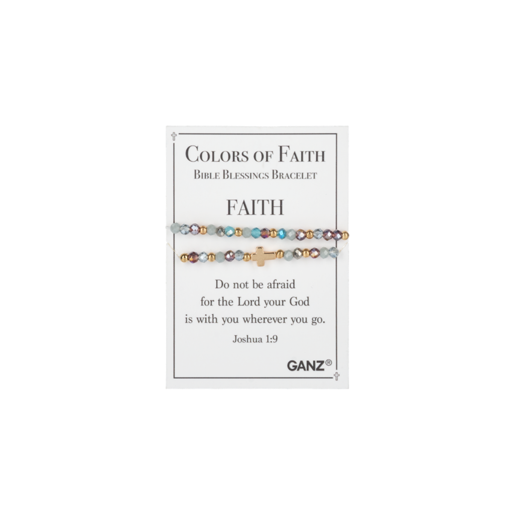 A multicolored beaded bracelet with a gold cross, from the Blessing Bracelets - Assorted collection, rests on a card titled “Colors of Faith.” The card displays the Joshua 1:9 Bible verse and the Flipflops & Whatnots brand name, making this beautiful piece of spiritual jewelry one of our cherished Bible blessings bracelets.