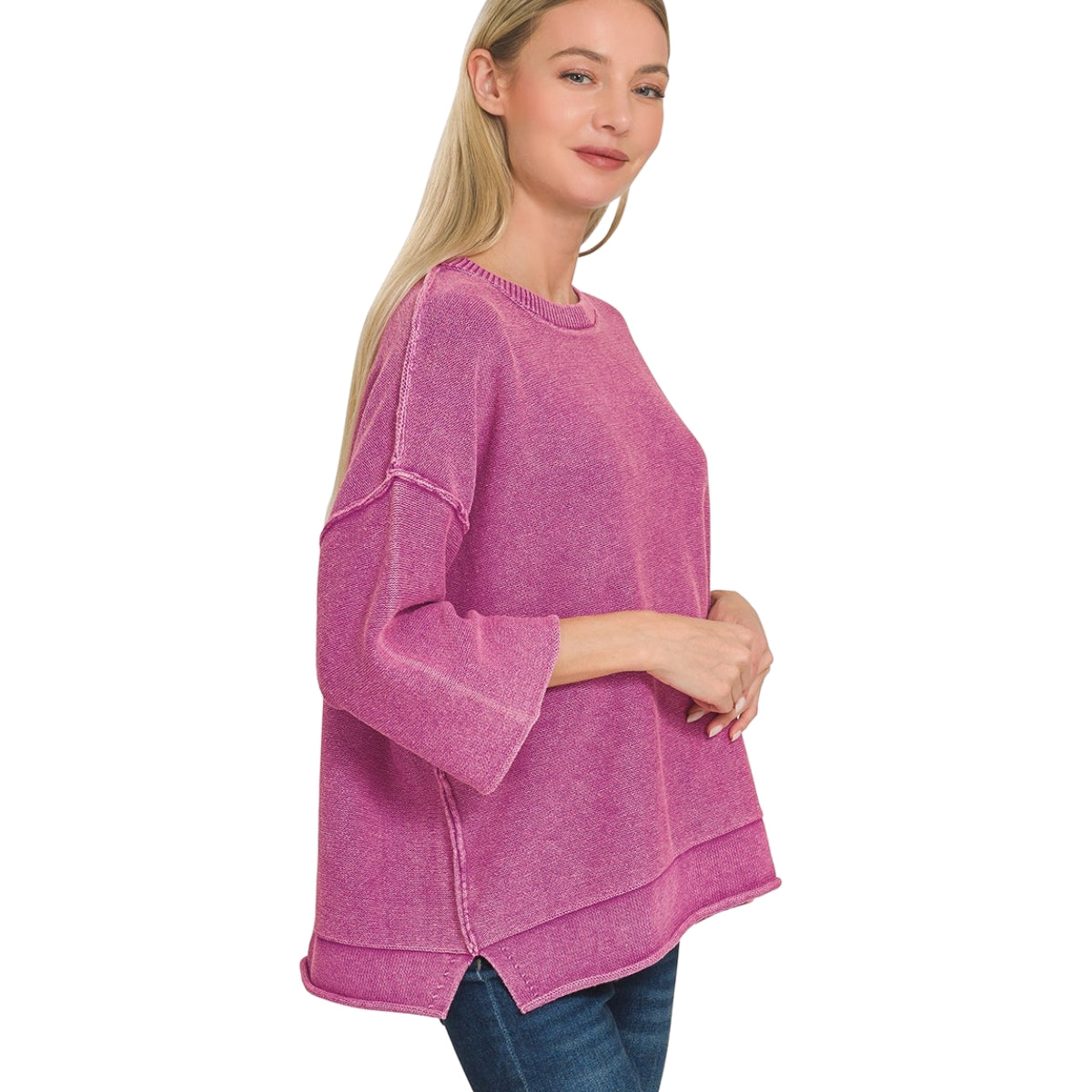 A woman wearing a magenta Women’s Washed Cotton Boxy Sweater with 3/4 Sleeves, featuring a boxy silhouette and visible seam detailing.