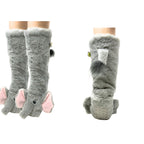 FASHION GO Elephant Cozy Slipper Socks are gray, furry knee-high slippers styled like elephants, complete with pink ears, black eyes, and little tails. Designed for women’s shoe sizes 5 to 10, these socks feature non-skid soles for extra safety. Displayed from the side and back on mannequin legs against a white background.