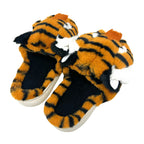Step into comfort with FASHION GO Tiger Fuzzy Slippers—a cozy pair of women’s slippers styled as tiger heads, complete with orange and black stripes, white accents, black inner soles, and a non-skid bottom.